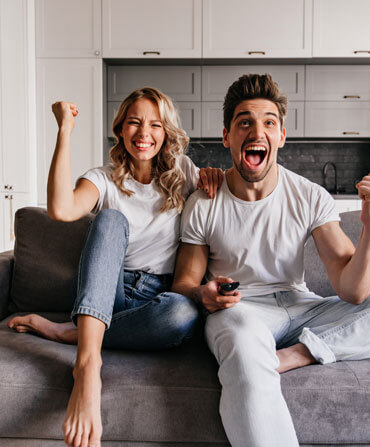 Family watching entertainment at home